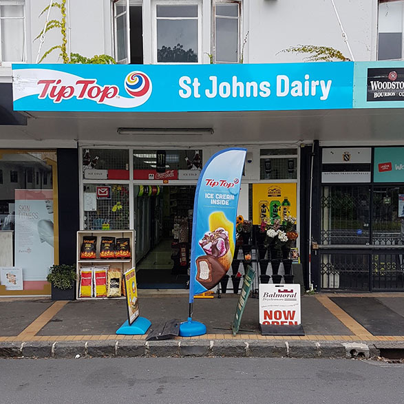 Gray Car in front of the Balmoral Drycleaners Store
